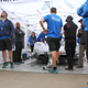 9:43 a.m.: Crew members start to look up at the greying sky—and bored at the car still sitting there.